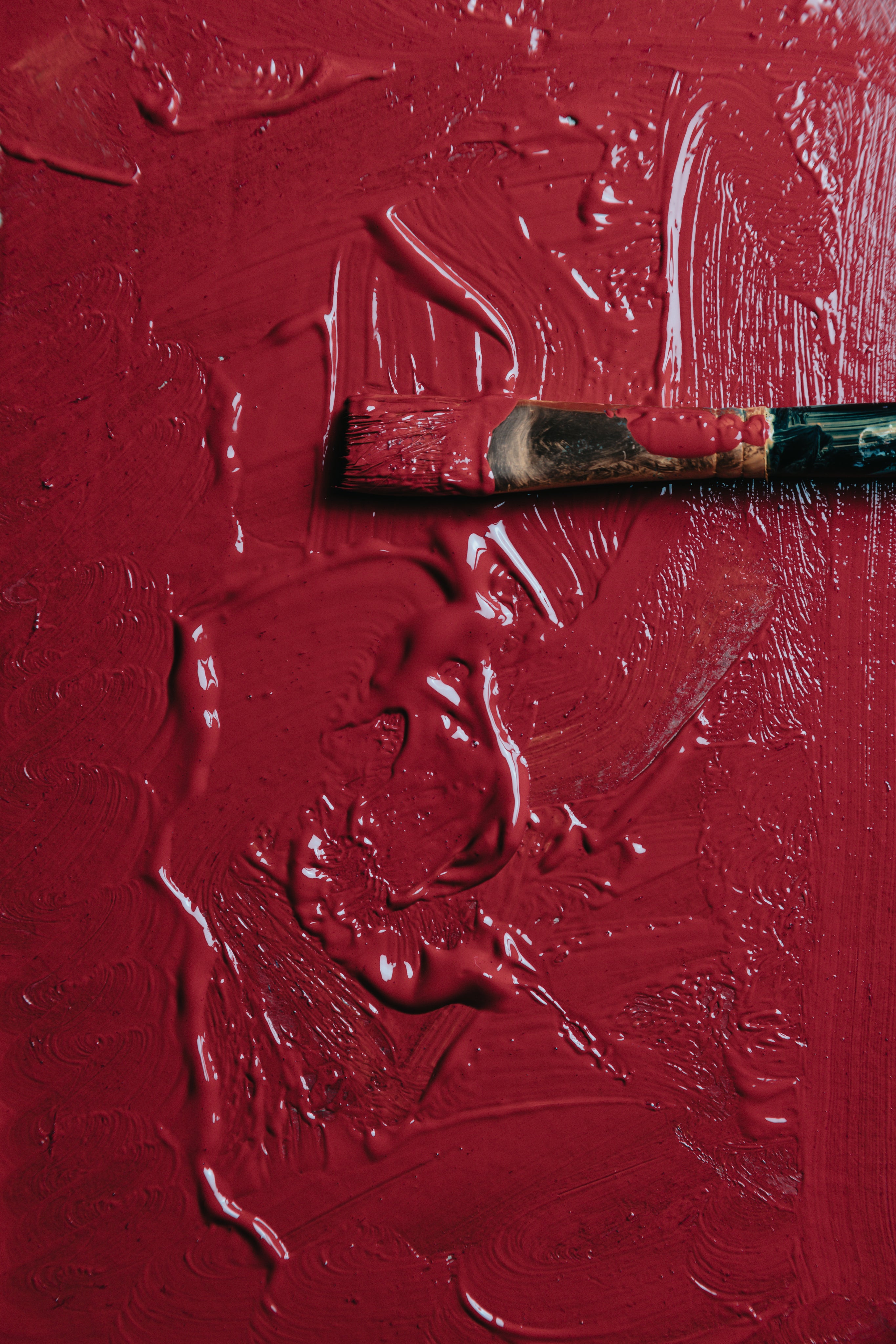 Red paint with paint brush